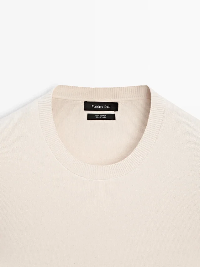 Baumwollstrickpullover mit Rundhalsausschnitt Baumwollstrickpullover mit Rundhalsausschnitt