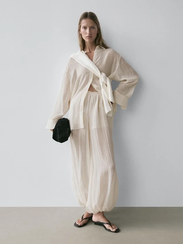 Fließende Sarouel-Hose mit Plissee-Detail Fließende Sarouel-Hose mit Plissee-Detail