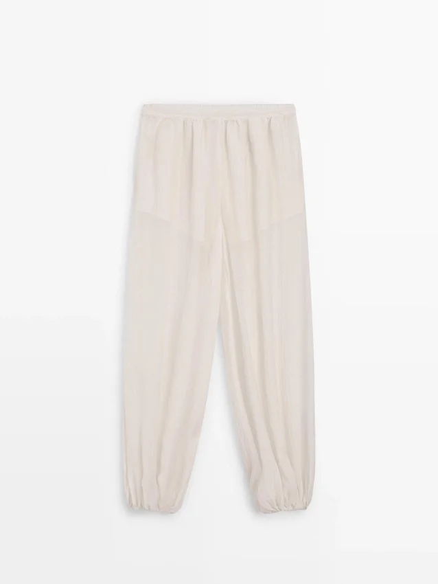 Fließende Sarouel-Hose mit Plissee-Detail Fließende Sarouel-Hose mit Plissee-Detail