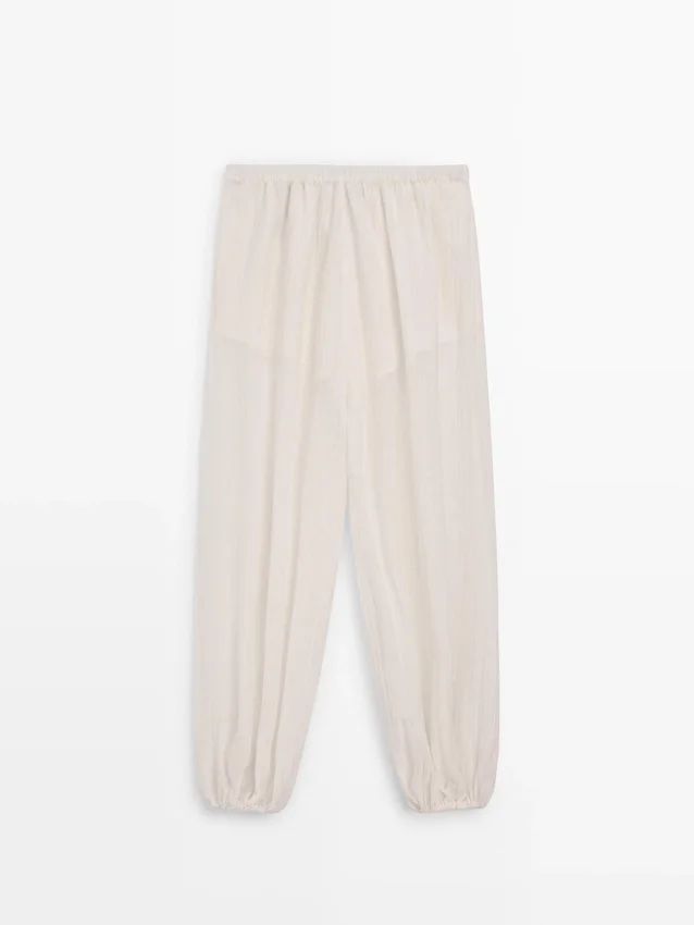 Fließende Sarouel-Hose mit Plissee-Detail Fließende Sarouel-Hose mit Plissee-Detail