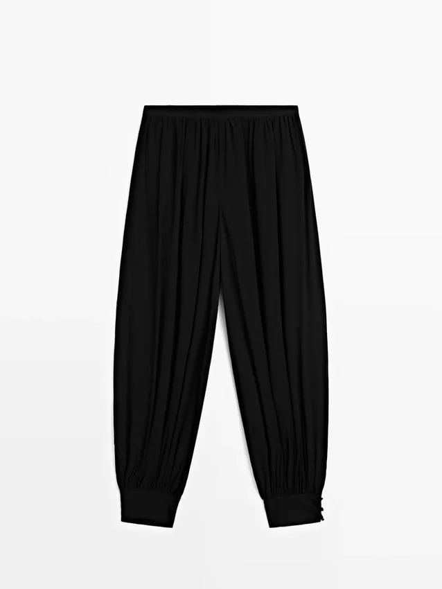 Halbtransparente Sarouel-Hose mit Knopfdetails Halbtransparente Sarouel-Hose mit Knopfdetails