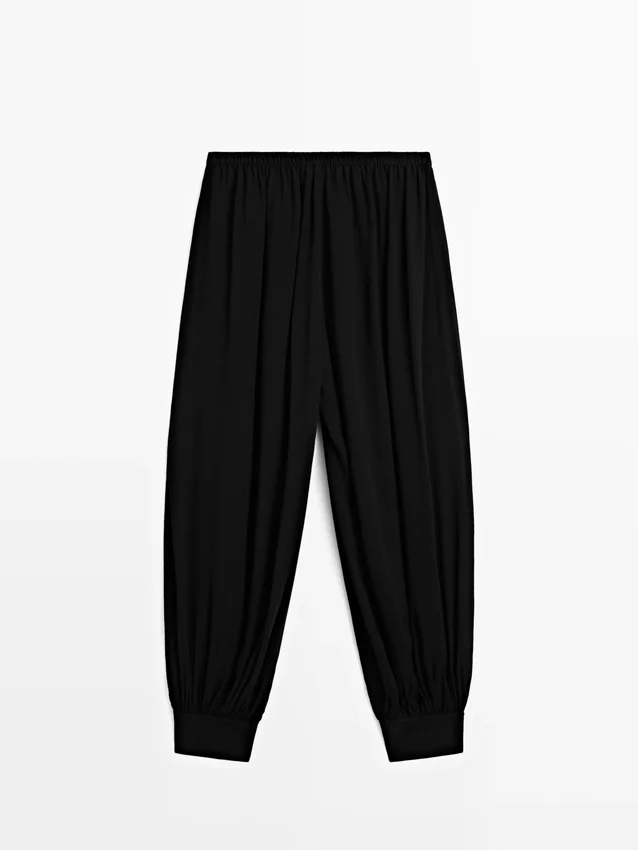 Halbtransparente Sarouel-Hose mit Knopfdetails Halbtransparente Sarouel-Hose mit Knopfdetails