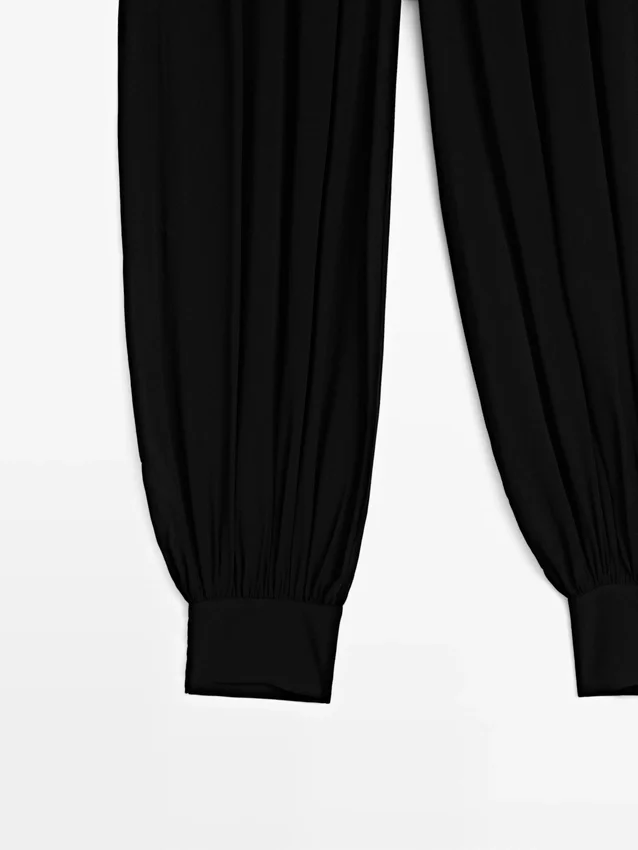 Halbtransparente Sarouel-Hose mit Knopfdetails Halbtransparente Sarouel-Hose mit Knopfdetails